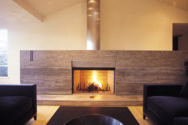 fireplace with concrete surround and hearth