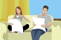 couple reading on sofa