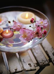 floating candles in a shallow glass dish