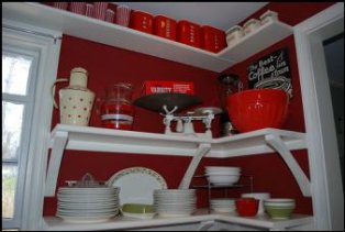 kitchen with red walls, kitchen appliances and accessories