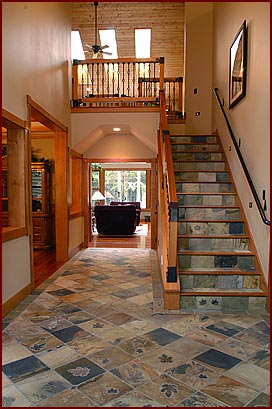 decorative tiling on hall floor and stairs