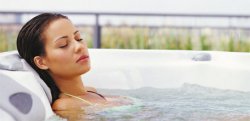 lady soaking in a hot tub