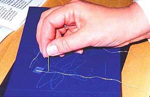 thread attached to back of card