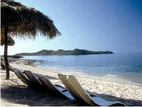 sun loungers on tropical beach